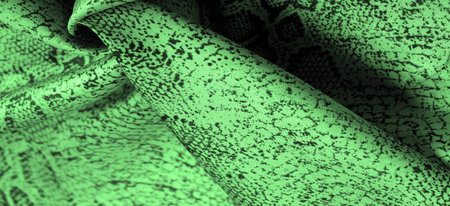 Texture, background, pattern, fabric with a green snake skin pattern, African fabric, designer photo - safari in the country of Africaの写真素材