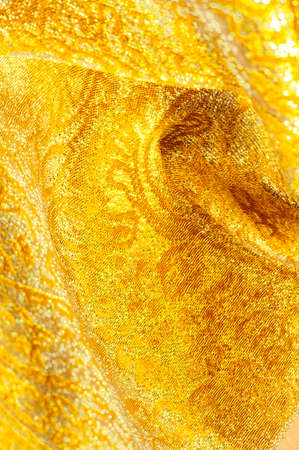 Texture background, pattern. fabric; yellow gold brocade. Organza brocade fabric - shepherd, with a...