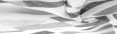White silk fabric with black geometric rhombus shapes. dark. Background. Template.の写真素材