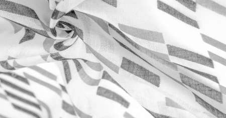 White silk fabric with black geometric rhombus shapes. dark. Background. Template.の写真素材