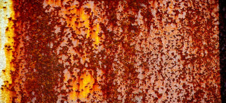 Rust on metal. Texture, background, pattern. When iron comes into contact with water and oxygen, it rusts. If salt is present, such as in seawater or salt spray, iron tends to rust more rapidly.の写真素材