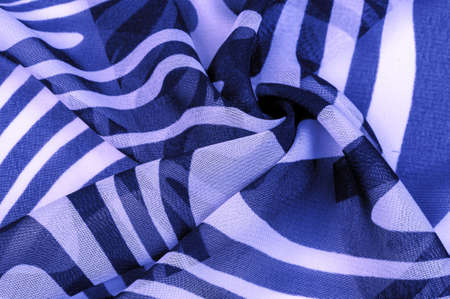 silk fabric, blue and white abstract lines. The magical shape of an abstract blue and white pattern. Retro modern decor, textile art, design, texture, background, patternの写真素材
