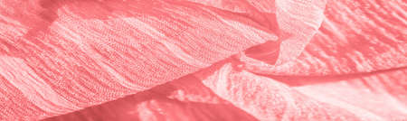 silk fabric. Texture of red wrinkled fabric. Red wrinkled fairy texture wavy surface, close-up, soft focus. background, patternの写真素材