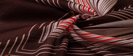 silk fabric, brown background with striped pattern of white and red lines, spanish theme, texture,...