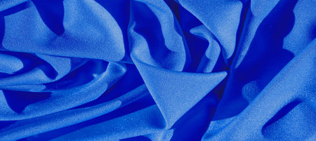 blue silk. Smooth elegant blue luxury silk fabric can be used as an abstract background with copy...
