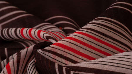 silk fabric, brown background with striped pattern of white and red lines, spanish theme, texture, pattern, collectionの写真素材