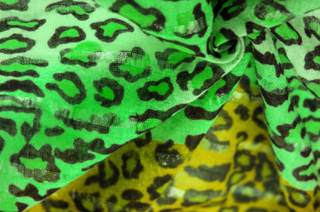 silk fabric green yellow with leopard print. Lightweight leopard print silk is perfect for your design, looks stylish and not vulgar! Texture, background, patternの写真素材
