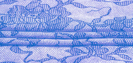 Light blue silk fabric with lace pattern. This elastic lace trim adds softness to everything! Texture, background, pattern.の写真素材