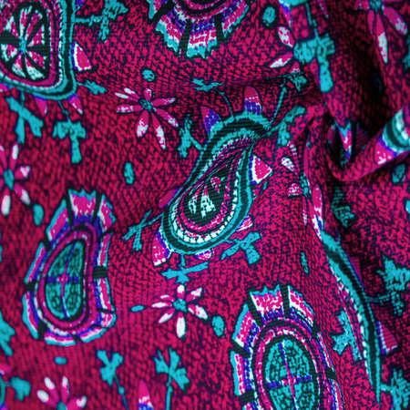 red silk fabric with blue patterns of flowers circles. Charmeus has a beautiful drapery. It can be...