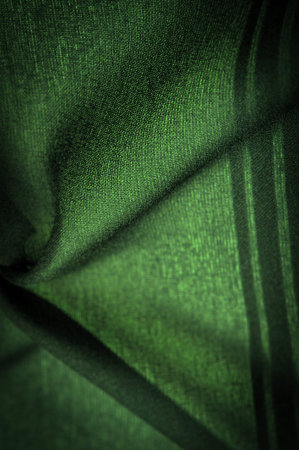 Green silk striped fabric. striped organza fabric. Background texture, decorative ornament. Background textureの写真素材
