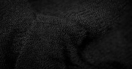 Black rough woolen fabric. Sheep with long, durable, coarse-fiber wool, especially suited to your design. As with various large breeds of lamb of English origin. Texture background patternの写真素材