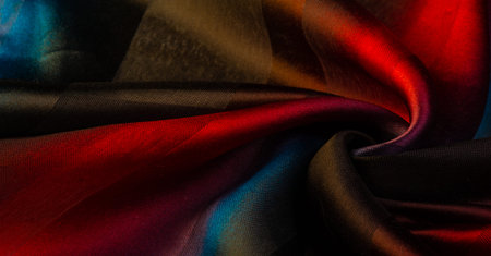 The silk scarf is dark in color. Green red blue blurred stripes. Delicate long gradient color stole,...