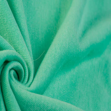 Green woolen fabric. Emerald green felt texture, abstract art. Background texture, patternの写真素材