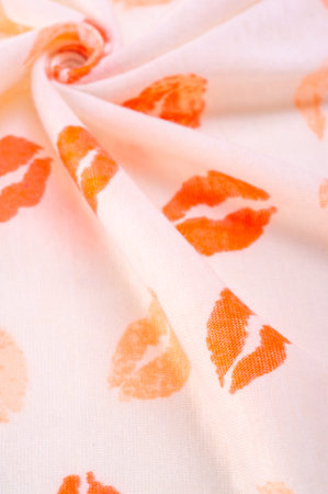 Texture background, groun, context, fond foil, field, white silk fabric with lip prints of kisses