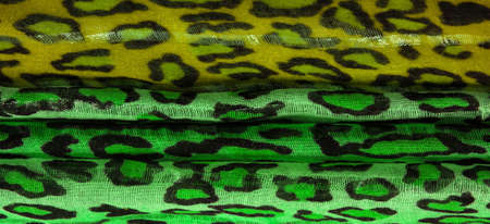 Texture, background, pattern, silk fabric green yellow with leopard print. Lightweight leopard print silk is perfect for your design, looks stylish and not vulgar!の写真素材