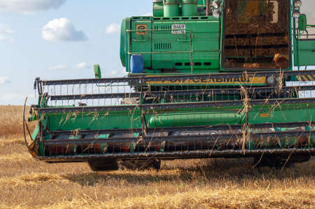 Summer photo of harvesting barley, the harvester mows barley in the fields. 2019 09 06 Tukaevsky District Tatarstan Russiaのeditorial素材