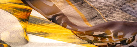 Texture, background, pattern, silk fabric, print on the theme of Africa, the skin of a wild beastの写真素材