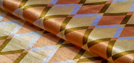 silk fabric with geometric square shapes in brown, yellow and white. Abstract background, blank...