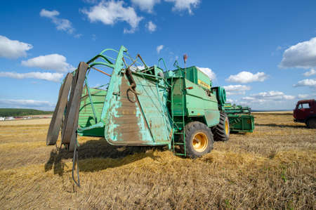 Summer photo of harvesting barley, the harvester mows barley in the fields. 2019 09 06 Tukaevsky District Tatarstan Russiaのeditorial素材