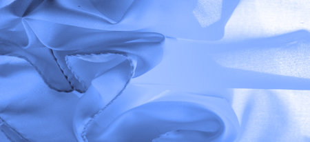 blue silk fabric, beautiful smooth elegant wavy blue satin silk luxury fabric, abstract design. background texture, patternの写真素材