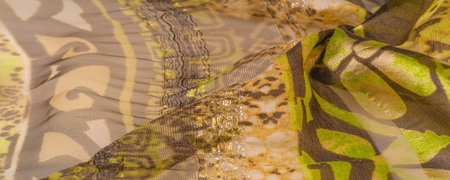 silk fabric, green-brown, abstract background luxury cloth or liquid wave or wavy folds of grunge...