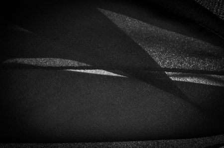 Dark black chiffon silk is a soft transparent fabric with a slight roughness (matte, creped) due to...