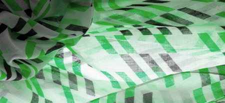 White silk fabric with green and black geometric rhombus shapes. abstract drawing chartreuse franc,...