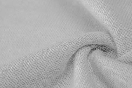 Black and white fabric with an abstract pattern, a print of branches with leaves of flora....