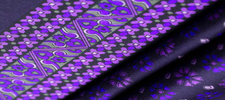 silk fabric of dark blue color with blue and purple flowers, dense fabric, double-sided based on...