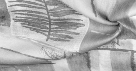 Black and white fabric with an abstract pattern, a print of flora branches. Texture. Background. Template.の写真素材