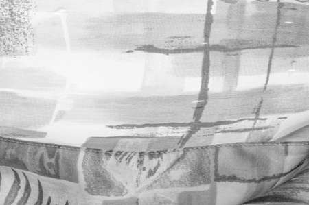 Black and white fabric with an abstract pattern, a print of flora branches. Texture. Background. Template.の写真素材