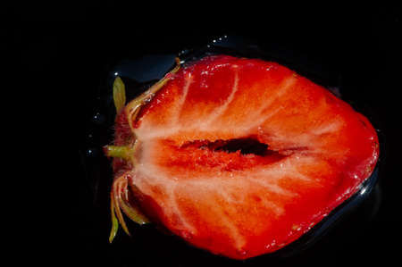 Strawberry. A plant with sweet aromatic pink-red berries and berries. Sweet soft red fruit with a seed-strewn surface.の写真素材