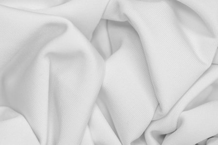 White silk fabric. Texture. Background. Pattern. Dupioni silk fabric has a shiny sheen and...