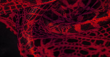 red background from textile material. lace fabric. Natural ruby texture. Texture, background, pattern.の写真素材