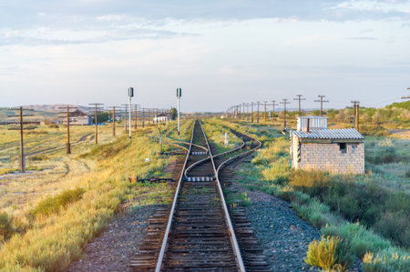 railway, railroad, rail, elevated. steppe.- is a means of transportation and passengers of trucks moving on rails that are located on the rails of the Great Plains. Kazakhstan The steppe is great.の写真素材