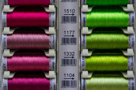 A thread is a continuous strand (made of fibers or threads twisted together), a long, thin strand of cotton, nylon, or other fibers used in sewing or weaving. 20 11 2020 Russia Chelnyのeditorial素材