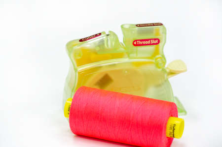 A thread is a continuous strand (made of fibers or threads twisted together), a long, thin strand of cotton, nylon, or other fibers used in sewing or weaving. 20 11 2020 Russia Chelnyのeditorial素材