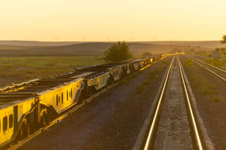 railway, railroad, rail, elevated. steppe.- is a means of transportation and passengers of trucks moving on rails that are located on the rails of the Great Plains. Kazakhstan The steppe is great.の写真素材