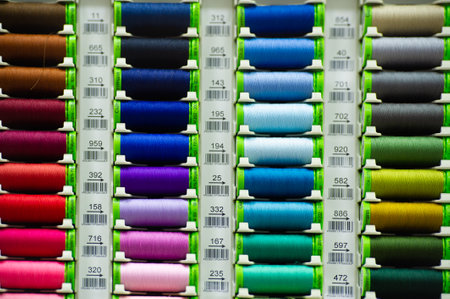 A thread is a continuous strand (made of fibers or threads twisted together), a long, thin strand of cotton, nylon, or other fibers used in sewing or weaving. 20 11 2020 Russia Chelnyのeditorial素材