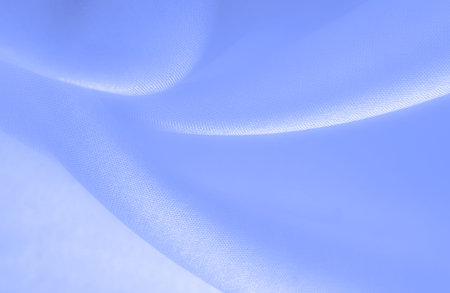 Blue pale silk fabric, smooth elegant blue silk or luxury satin fabric, texture as a wedding...