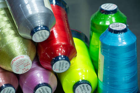 A thread is a continuous strand (made of fibers or threads twisted together), a long, thin strand of cotton, nylon, or other fibers used in sewing or weaving. 20 11 2020 Russia Chelnyのeditorial素材