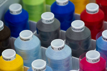 A thread is a continuous strand (made of fibers or threads twisted together), a long, thin strand of cotton, nylon, or other fibers used in sewing or weaving. 20 11 2020 Russia Chelnyのeditorial素材