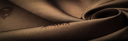 silk fabric, color brown, delicate pattern, pattern in the form of a combination of lines, shadows. texture background. template. chocolateの写真素材