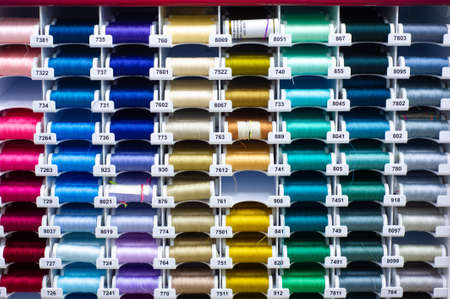 A thread is a continuous strand (made of fibers or threads twisted together), a long, thin strand of cotton, nylon, or other fibers used in sewing or weaving. 20 11 2020 Russia Chelnyのeditorial素材