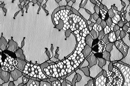 Black lace fabric. Vintage floral background. dark black vintage old floral laceの写真素材