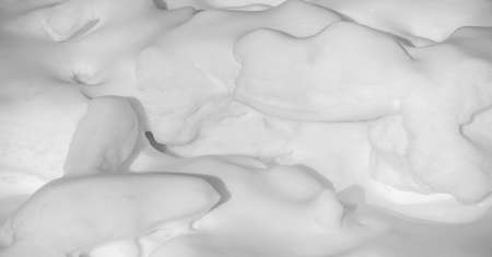 Snow texture atmospheric water vapor frozen into ice crystals and falling in light white flakes or lying on the ground as a white layer.の写真素材