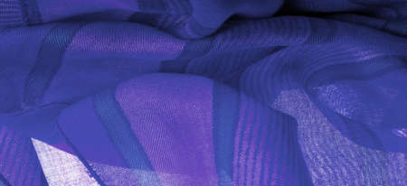 The silk fabric is azure blue, bright blue, like a cloudless sky. Texture. Background.の写真素材