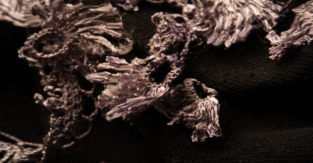 Dark brown woolen scarf. with a sewn-on lace on a strip. Texture. Background. Templateの写真素材