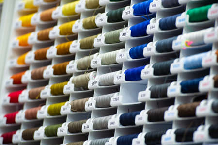 A thread is a continuous strand (made of fibers or threads twisted together), a long, thin strand of cotton, nylon, or other fibers used in sewing or weaving. 20 11 2020 Russia Chelnyのeditorial素材