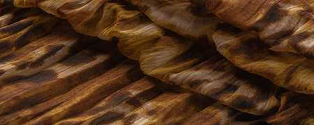 Silk fabric made of fine organza with print imitating panther skin, brown. Texture. Background. Template.の写真素材